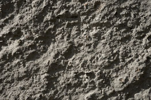 Brown hardened concrete in the sun . Shadow on the concrete