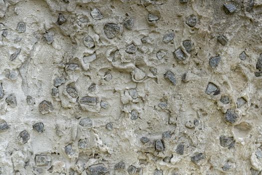 Background: Concrete product made of large granite rubble