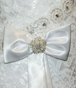Part of the bride's wedding dress. Bow on the dress. Wedding Dress