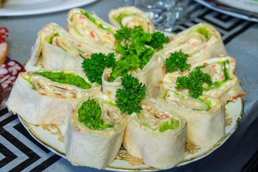 Pita bread with cheese and seafood on a plate decorated with parsley