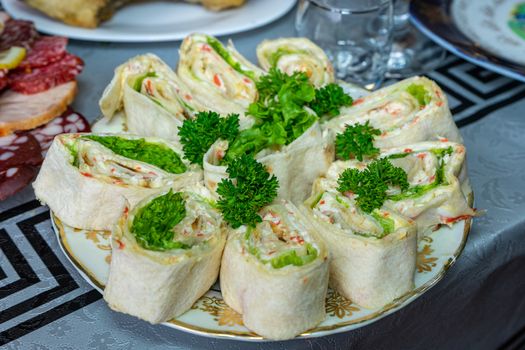 Pita bread with cheese and seafood on a plate decorated with parsley