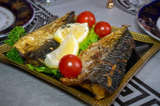 Baked mackerel with tomatoes and lemon