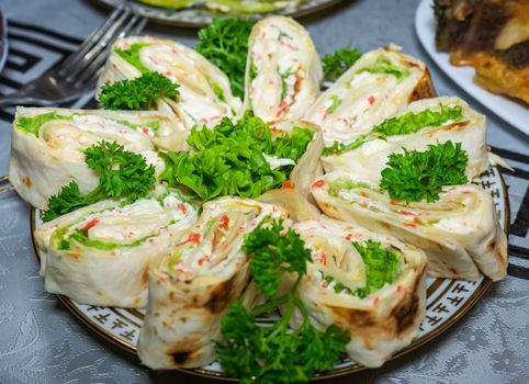 Pita bread with cheese and seafood on a plate decorated with parsley