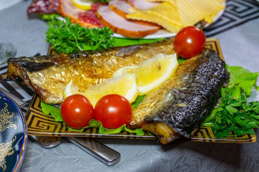 Baked mackerel with tomatoes and lemon