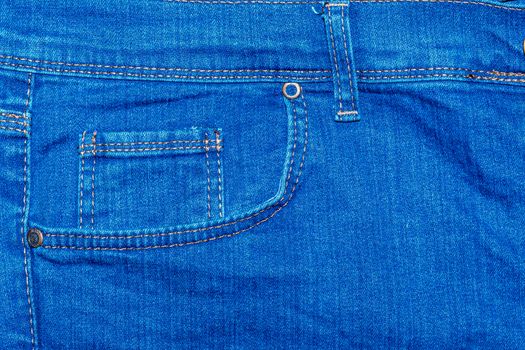 Pocket on denim pants photographed close up