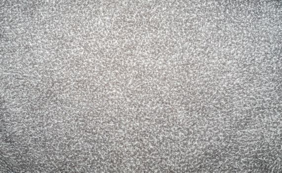 Light gray background with white specks. Background from gray matter