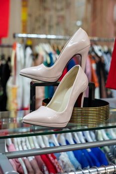 Pink shoes on a shop window. Women's shoes with heels