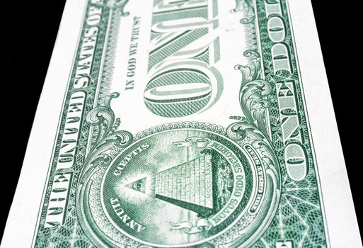 Trimmed perspective photo of a dollar bill, black background 