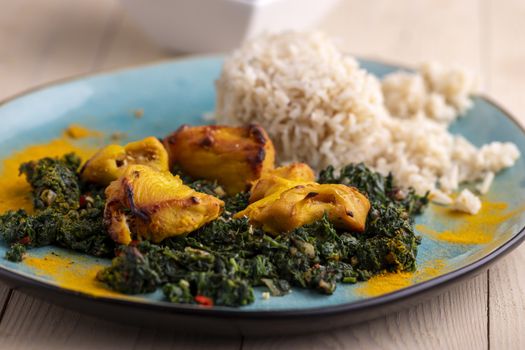 indian murgh palak dish with rice