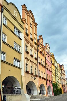 Facades of historic tenement houses with arcades on the market in the city of Jelenia Gora in Poland