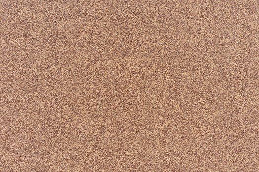 Light brown background with dark brown speckles