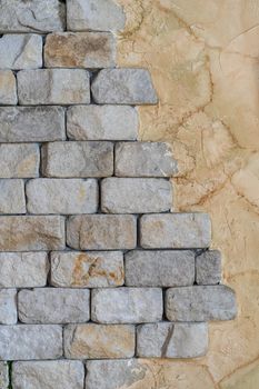 Gray brick wall. Cement on the wall. Vertical background