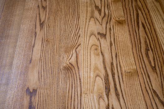 Brown wooden floor. Brown laminate on the floor. Background