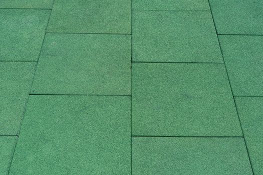 Green tile floor. Floor coverings. Large floor tiles