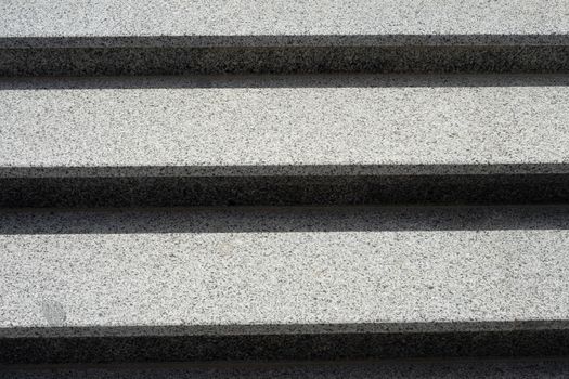 Stairs made of gray granite. Horizontal background. Stairs close up