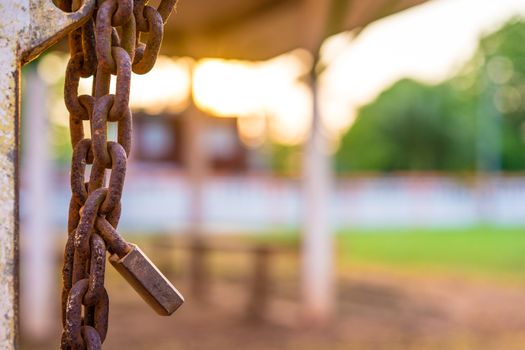 Old rusty padlock and chain on the door