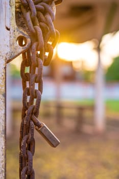 Old rusty padlock and chain on the door