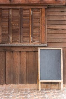 blank menu board on wood wall