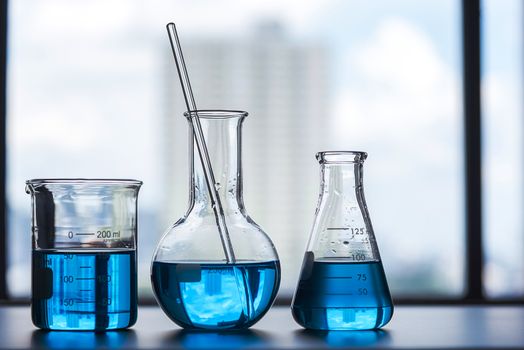 science laboratory beaker, erlenmeyer flask, laboratory equipment concept