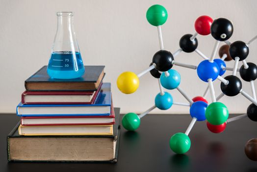 science laboratory test tubes and book stack , laboratory equipment