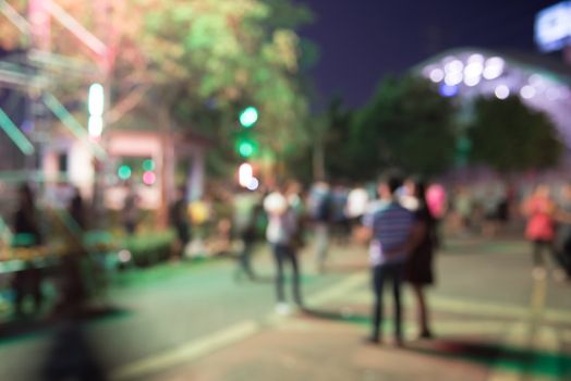 abstract blurred people at night market  festival