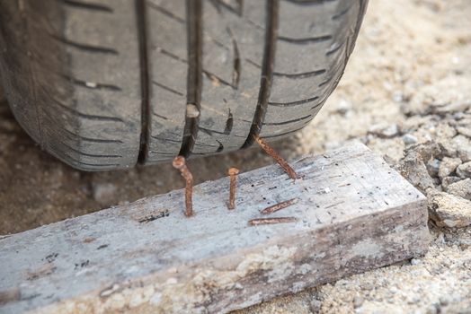 car wheel hitting the nail , car accident concept