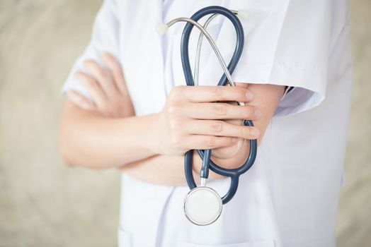 confidential woman doctor with green stethoscope in hand