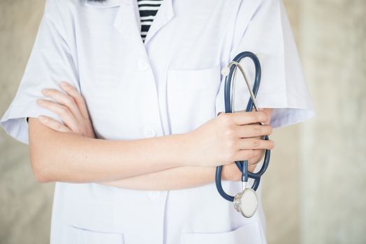 confidential woman doctor with green stethoscope in hand