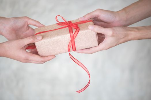woman hand giving giftbox