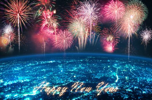 fireworks over blue night city and text HAPPY NEW YEAR for happy new year celebration