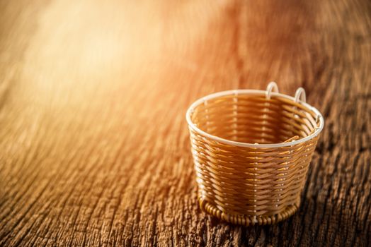 vintage small basket on wooden table