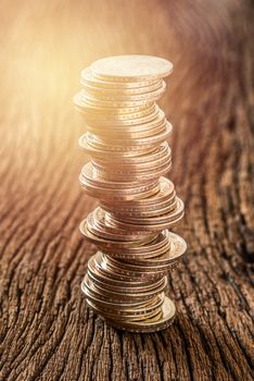 stack of dollars money coin on grunge wooden background