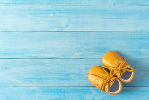 kids fashion shoes on light blue wood plank background