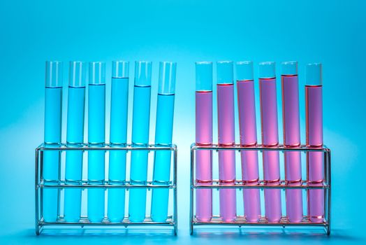 science laboratory test tubes on light blue background , laboratory equipment