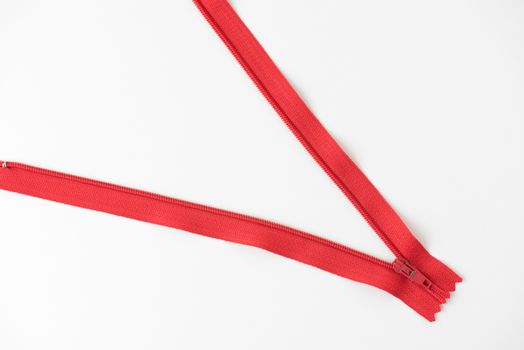 metal red zip on white background.