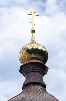 bottom view domes of christian church with crosses on blue sky background in Ukraine