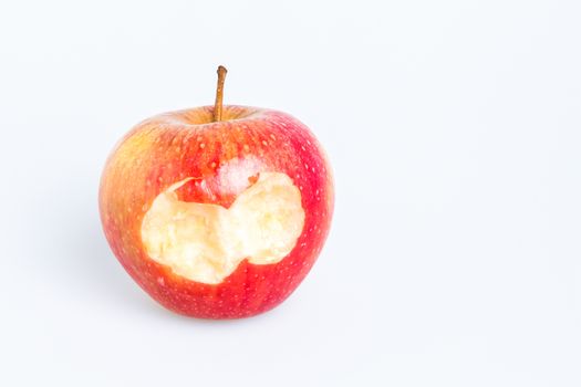 Red Delicious Apple on White Background. Missing a bite.