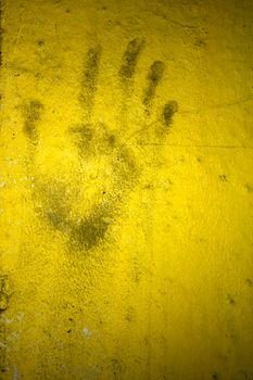 Grungy wall with hand print. It can be used as a backdrop, grungy wallpaper, design t-shirts and more. Fully editable.
