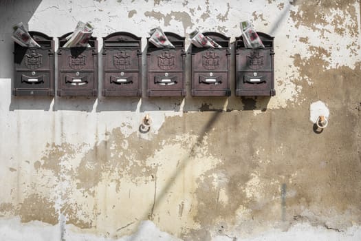 Old mailboxes hanging on the wall