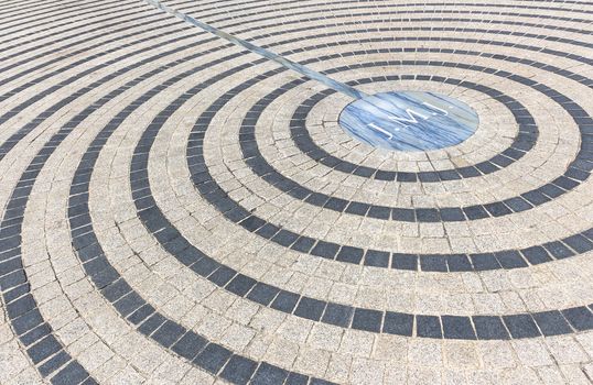 Close-up of pavement with concentric pattern. Patterned floor walkway of the large square of a church.