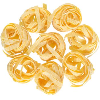 pasta pappardelle nest top view close up on a isolated white background.