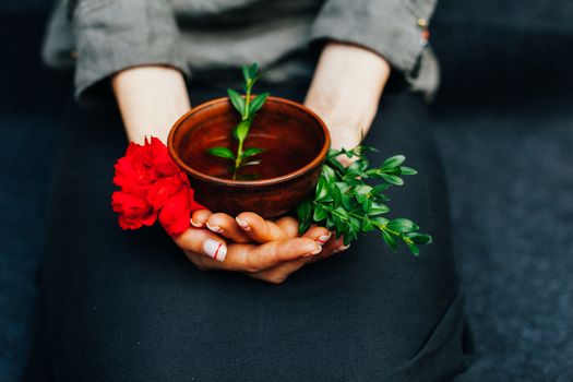 Woman offers hot tea in a vintage ceramic cup. Traditional tea ceremony