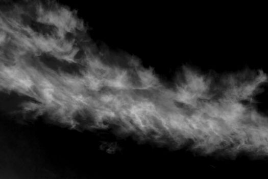 Cloudscape background of a cirrus cloud black and white monochrome image