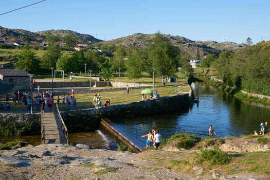 River beach in Albergaria da Serra full of tourists in Serra da Freita Arouca Geopark, in Portugal