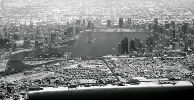 Aerial view of Dubai bay with apartments and skyscrapers (United Arab Emirates)