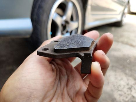 close up to brake pad in brake of the car