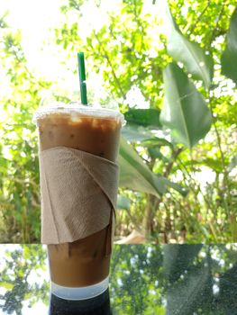 ice coffee on the table with sunlight