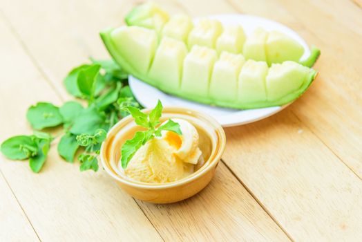 ice cream melon on wood table