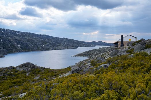 Beautiful house social distancing in lake Lagoa comprida lagoon in Serra da Estrela, Portugal