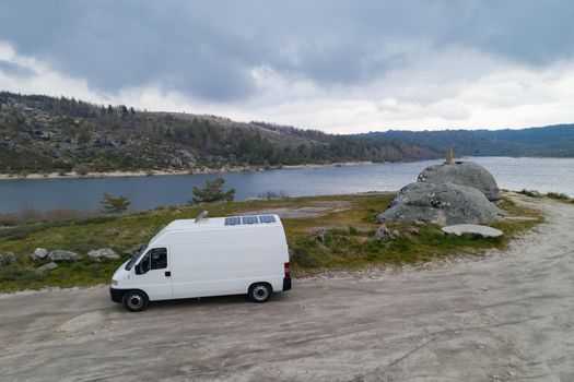 Landscape drone aerial view of a van social distancing vanlife in Vale do Rossim in Serra da Estrela, Portugal